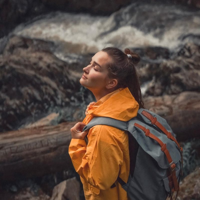 woman-traveller-with-backpack-somewhere-in-forest-near-the-waterfall-1.jpg